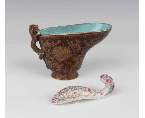 A Chinese gilt decorated brown ground porcelain libation cup, mark of Qianlong but later Qing dynasty, the exterior decorated