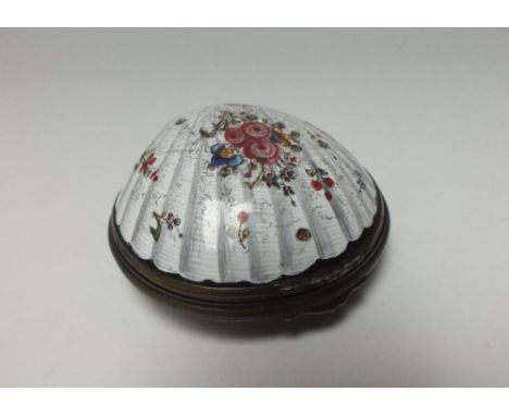 A 19TH CENTURY ENAMEL SNUFF BOX, of scalloped shell form with gilt metal mounts, naturalistically modelled and painted with a