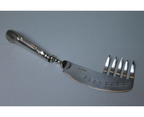 AN UNUSUAL SILVER SERVER, in the style of a fish server with additional five prong fork edging, the 'blade' is hallmarked for