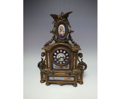 A 19TH CENTURY CONTINENTAL GILT METAL AND PORCELAIN CLOCK, the circular  painted dial with Roman Numerals, flanked either sid