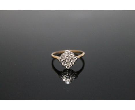 AN 18 CARAT NINE STONE DIAMOND RING, with an approx total diamond weight of 0.32 carat, ring size K
Buyers - for shipping pri