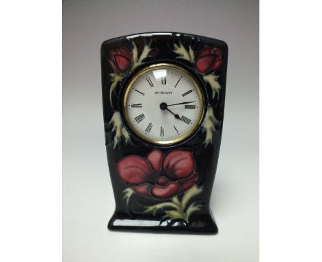 A MOORCROFT 'ANEMONE' MANTEL CLOCK, blue ground with tubelined decoration, impressed and painted marks to base, H 16 cm