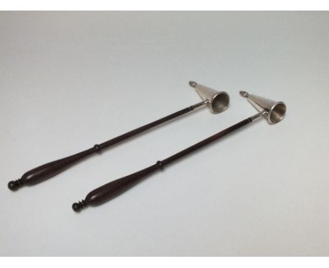 A PAIR OF SILVER PLATED CANDLE EXTINGUISHERS, flame shaped finial to end of extinguisher, turned wooden handles, L 30 cm (2)
