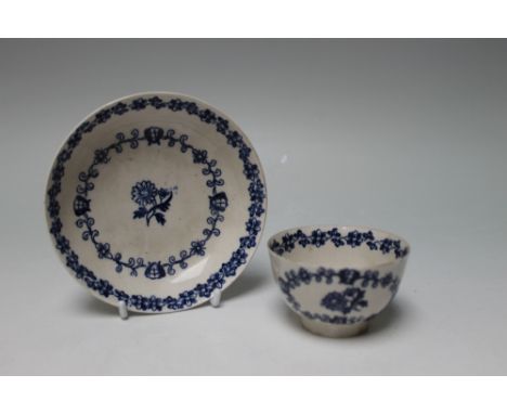 AN EARLY WORCESTER TYPE TEA BOWL AND DISH, decorated with floral band and central floral spray, dish Dia 13.5 cm
Buyers - for