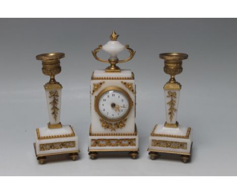 A FRENCH 19TH CENTURY CLOCK GARNITURE OF SMALL PROPORTIONS, the alabaster and gilt metal clock with a drum movement, stamped 