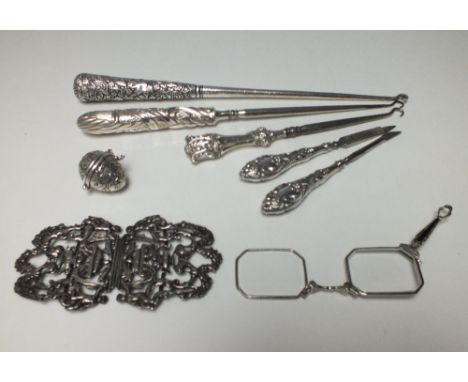 A SELECTION OF SILVER HANDLED VANITY / DRESSING TABLE ITEMS, together with a nurse's belt buckle, a white metal egg shaped tr