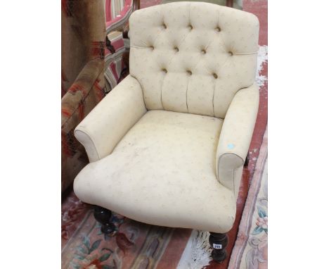 A Victorian style button back upholstered armchair 