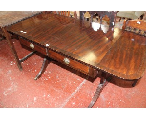 A Regency style mahogany and inlaid sofa table with two frieze drawers on end supports with splayed legs 76cm high, 92cm wide
