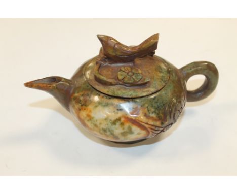 AN ORIENTAL CARVED JADEITE TEAPOT AND COVER, bird finial to lid, H 8 cm