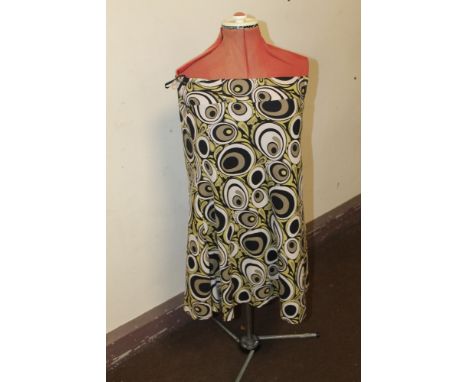 A VINTAGE ADJUSTABLE DRESS MAKERS DUMMY, together with a 1960s skirt