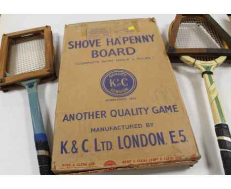A BOXED SHOVE HA'PENNY BOARD WITH COINS, together with two vintage tennis racquets