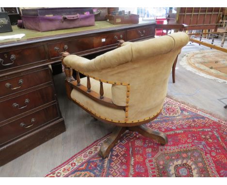 A circa 1900 office swivel chair with button back suede upholstery, 85cm x 66cm x 72cm (with receipt of purchase) 