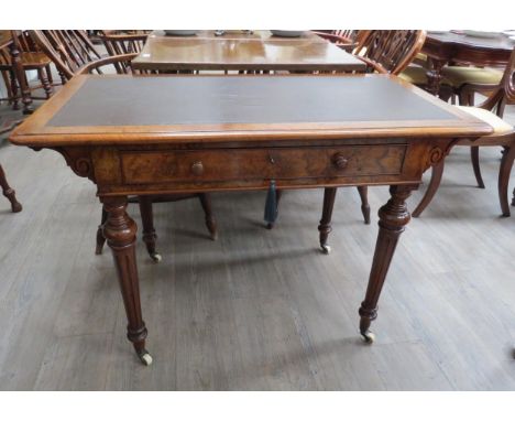 Circa 1860 a burr walnut writing table the single frieze drawer with working lock and key over tapering ring turned legs on b