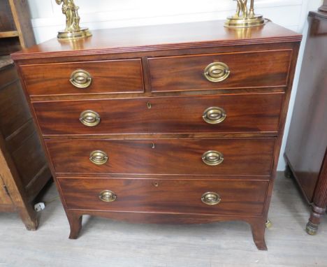 A circa 1840 flame mahogany caddy top reeded edge chest of two short over three graduating long drawers with brass oval plate