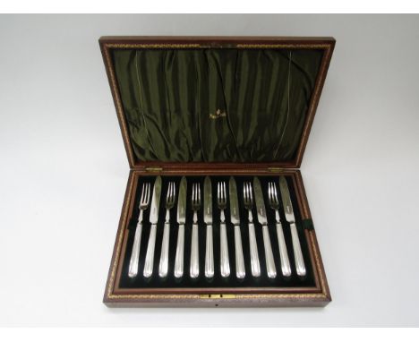 A set of twelve plated fruit knives and forks with Alpha plate blades and forks, in Mappin &amp; Webb walnut case 