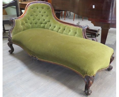 A Mid 19th Century rosewood chaise-longue with green velour button back upholstery, carved acanthus floral and scroll detail 