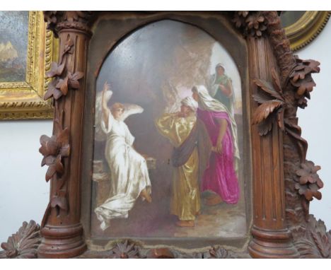 A 19th Century carved hardwood easel-back framed religious porcelain plaque in the form of a Renaissance reliquary altar piec