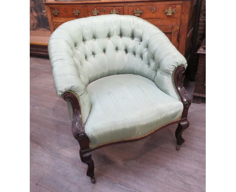 A 19th Century button back tub chair with watered silk upholstery, the frame with scroll acanthus carving, cabriole legs 