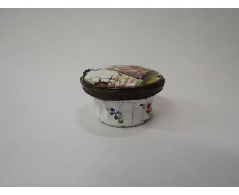 A late 19th Century Bilston enamel patch box with figural detail to top, damage present, 2.2cm x 4cm diameter 