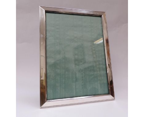 A Sanders &amp; Mackenzie silver easel back photograph frame, Birmingham 1915, 46cm x 35cm total 