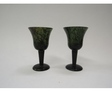 A pair of moss jade wine glasses, 10cm tall 