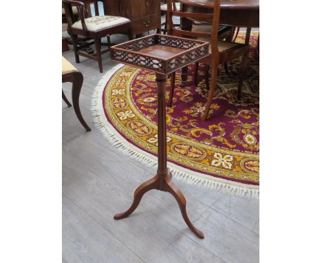 A Georgian decorative jardinière/torchere stand with pierced gallery, reeded column to tripod base, 76cm high 