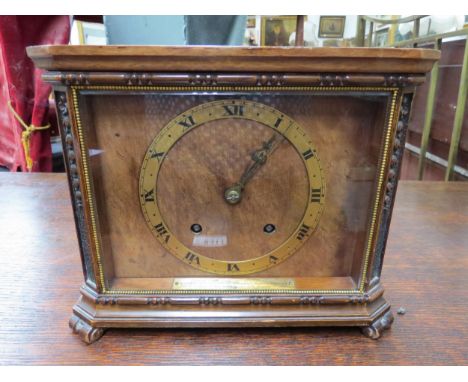 A circa 1930's walnut mantel clock with Roman numeral chapter ring, two train movement with presentation details, 20cm high x