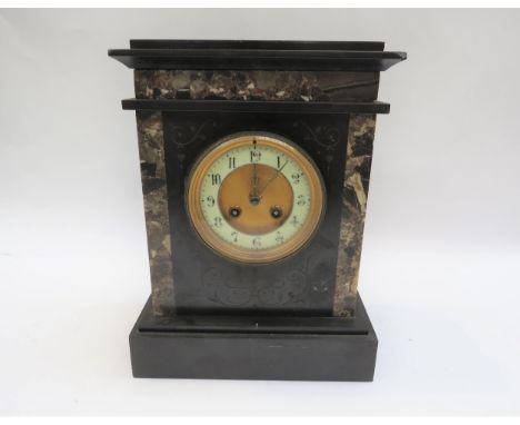 A twin train slate and marble mantel clock numerated chaptering with key, 32cm tall 