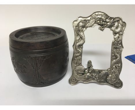 A Chinese Republic ceramic tobacco jar and a silver plated photo frame (2)