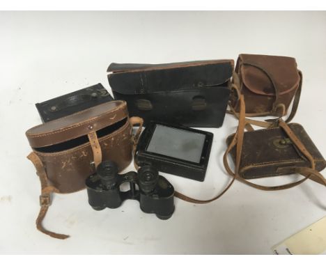 A pair of Military binoculars No 3 MK1 and vintage cameras.