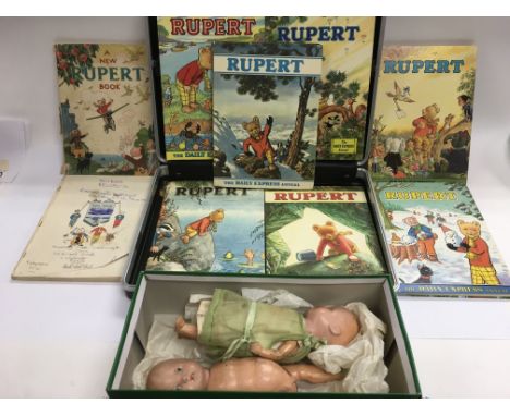 A collection of Rupert the bear annuals and two vintage dolls - NO RESERVE