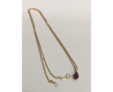 An 18ct gold ruby and diamond set pendant necklace.Approx 23cm, 4.2g