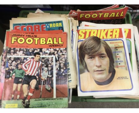 A crate containing a collection of vintage football magazines, various titles including Score, Striker, Shoot, Goal etc.