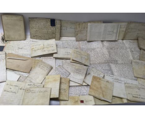 A leather trunk containing a collection of 18th century indentures relating to subjects including property, probate and marri