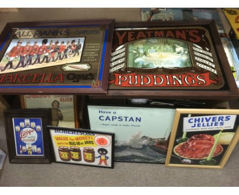 Seven framed vintage advertising signs and mirrors.