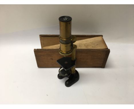 A small brass and cast iron microscope
