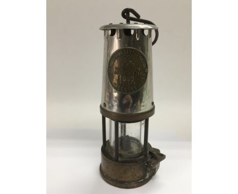A vintage miner's protector lamp.