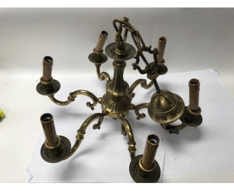 A group of light fittings to include a chandelier with six branches and two wall fittings, all with faux candle pieces - NO R
