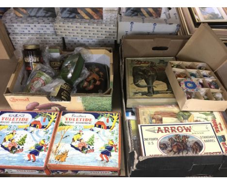 A collection of vintage advertising tins and signs plus old jigsaw puzzles and Christmas baubles.
