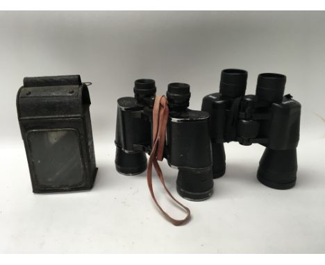 Two pairs of binoculars including a Greenkat pair and a railway lamp.