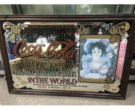 A vintage Coca Cola advertising mirror, approx 95cm x 63cm together with a Laroche Parfum advertising mirror, approx 27cm x 3