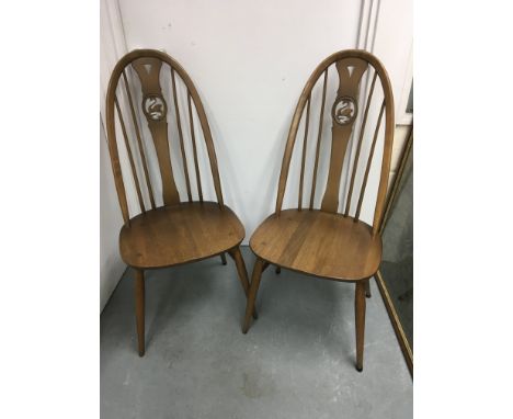 A set of four  Ercol dining chairs .