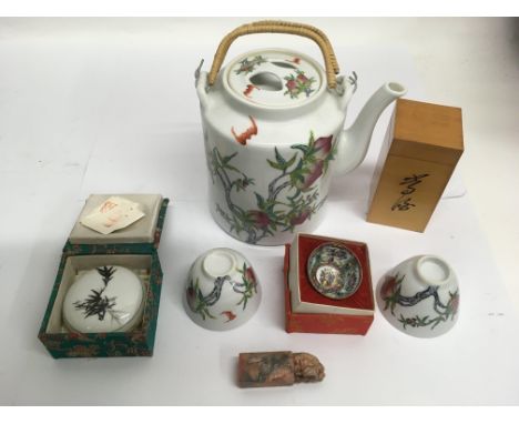 A 20th century Chinese Peach Bloom teapot and cups, a seal and other items