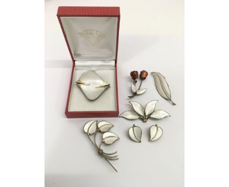 A group of vintage, Norwegian silver and white enamel jewellery comprising brooches and a pair of earrings