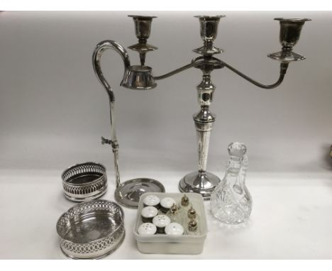 A collection of good quality silver plated items including two wine coasters, a three branch candelabra, wine holder etc.