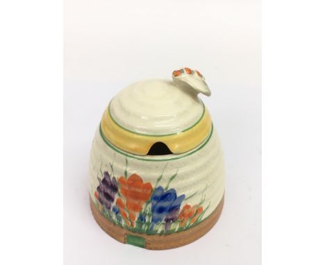 A Clarice Cliff 'Crocus' pattern honeypot, of ribbed form.Approx 9cm