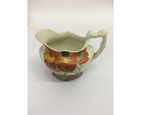 A Clarice Cliff 'Rhodanthe' pattern jug.Approx 11cm, some discolouration to underside of base.