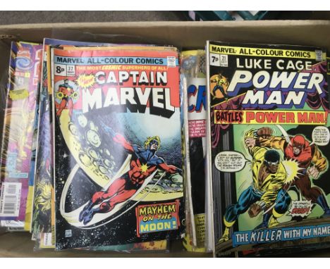 A collection of vintage comics including various Marvel  and DC examples.