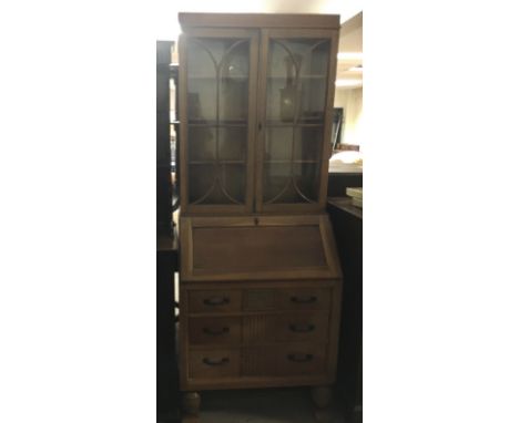 A light wood bureau bookcase.Approx 73x20x193cm high
