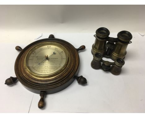 A pair of old brass cased binoculars, a smaller leather cased binocular and a barometer together with a serpentine stone ligh